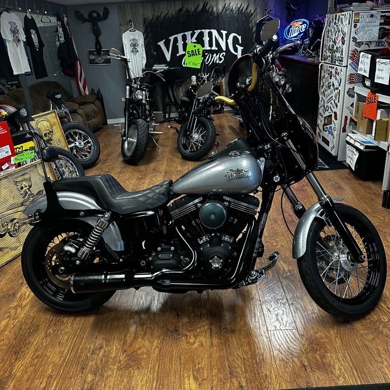 2015 Harley-Davidson Dyna Glide Street Bob for sale in Pompano Beach Florida show room with metallic candy paint